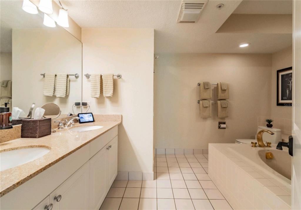 36750 Highway 19, Unit 82011 Palm Harbor, FL 34684 - Photo 12 of 15 a bathroom with a sink a toilet and mirror