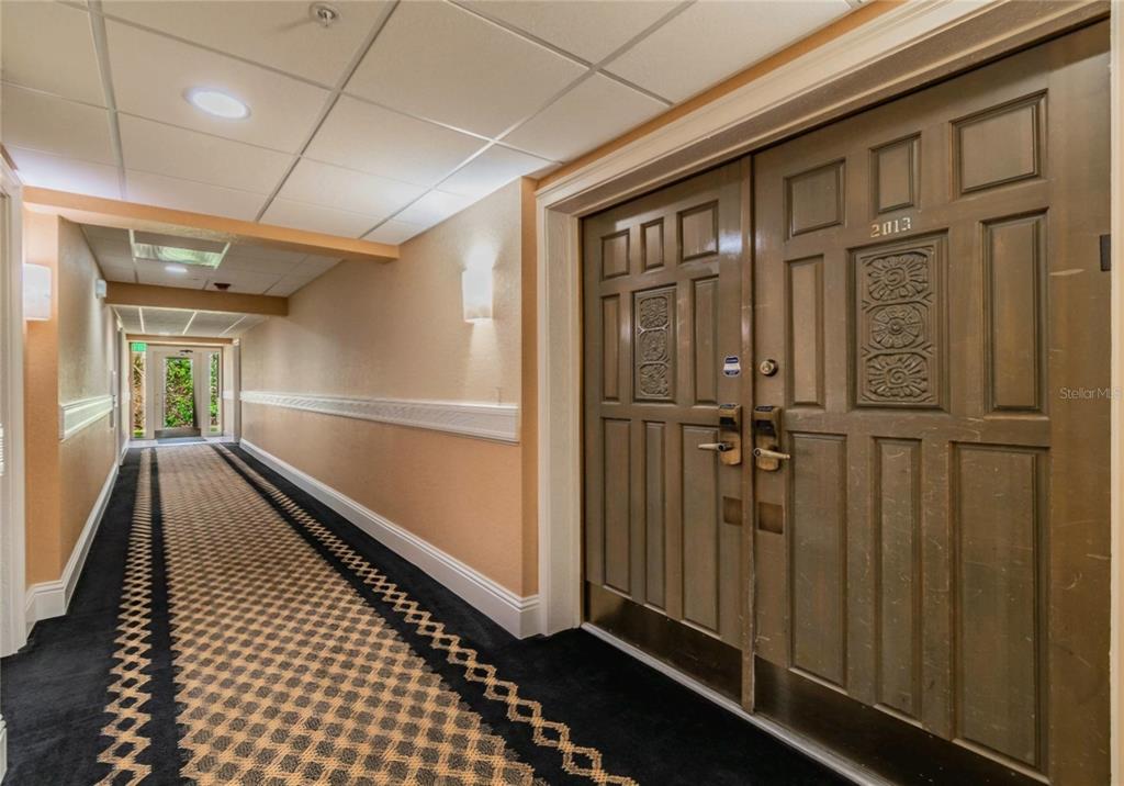36750 Highway 19, Unit 82011 Palm Harbor, FL 34684 - Photo 2 of 15 a view of a hallway with wooden floor and staircase
