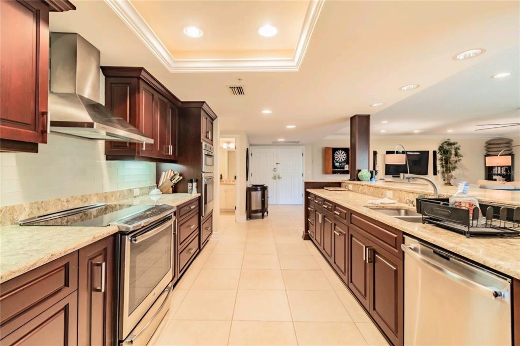 36750 Highway 19, Unit 82011 Palm Harbor, FL 34684 - Photo 5 of 15 a large kitchen with stainless steel appliances lots of counter space and a sink