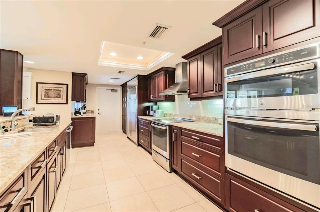 36750 Highway 19, Unit 82011 Palm Harbor, FL 34684 - Photo 6 of 15 a kitchen with stainless steel appliances granite countertop a stove and cabinets