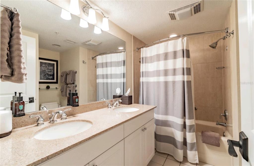 36750 Highway 19, Unit 82011 Palm Harbor, FL 34684 - Photo 9 of 15 a bathroom with a double vanity sink mirror and double