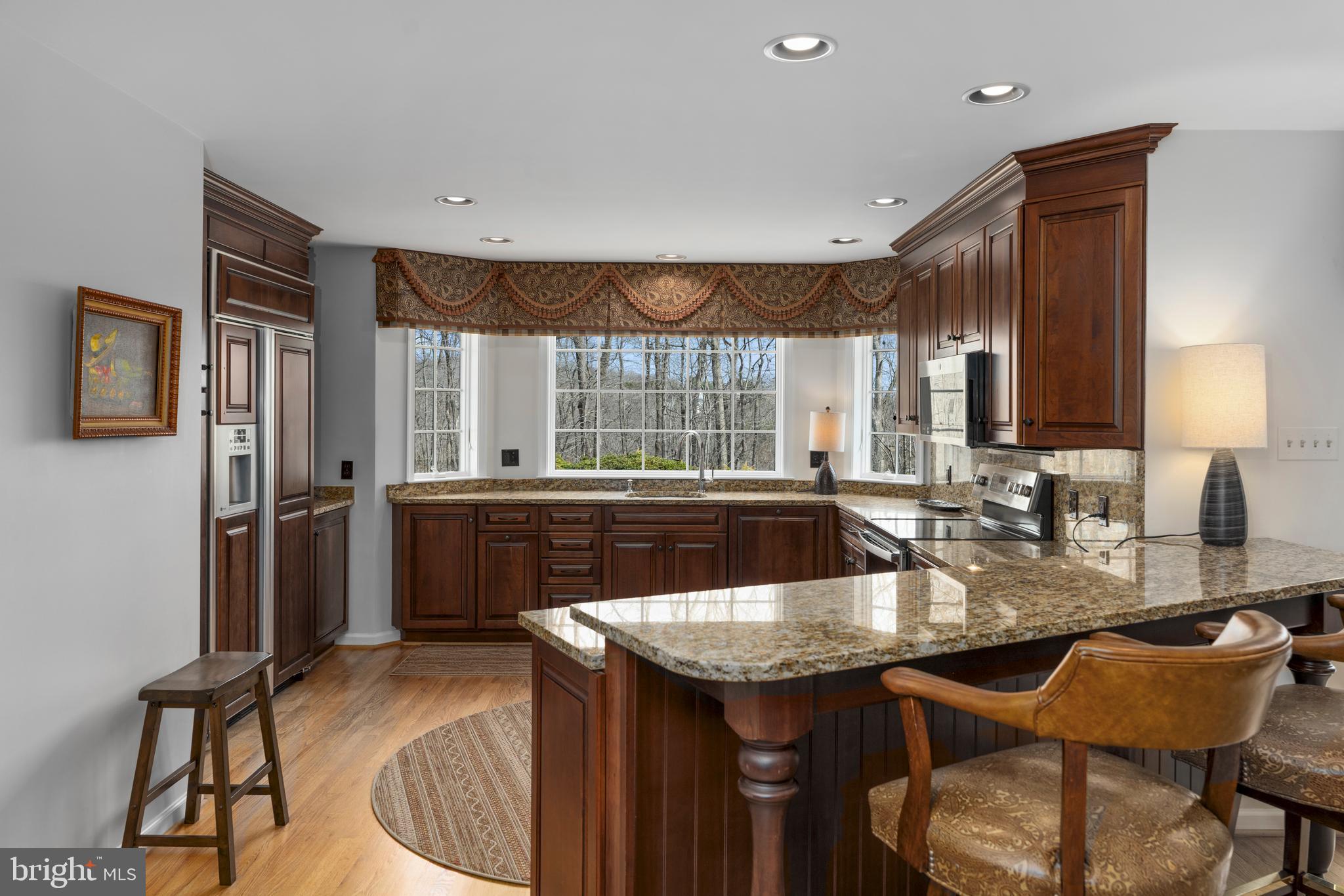 1116 Wiseburg Road Parkton, MD 21120 - Photo 14 of 54 a kitchen with granite countertop a sink and a refrigerator