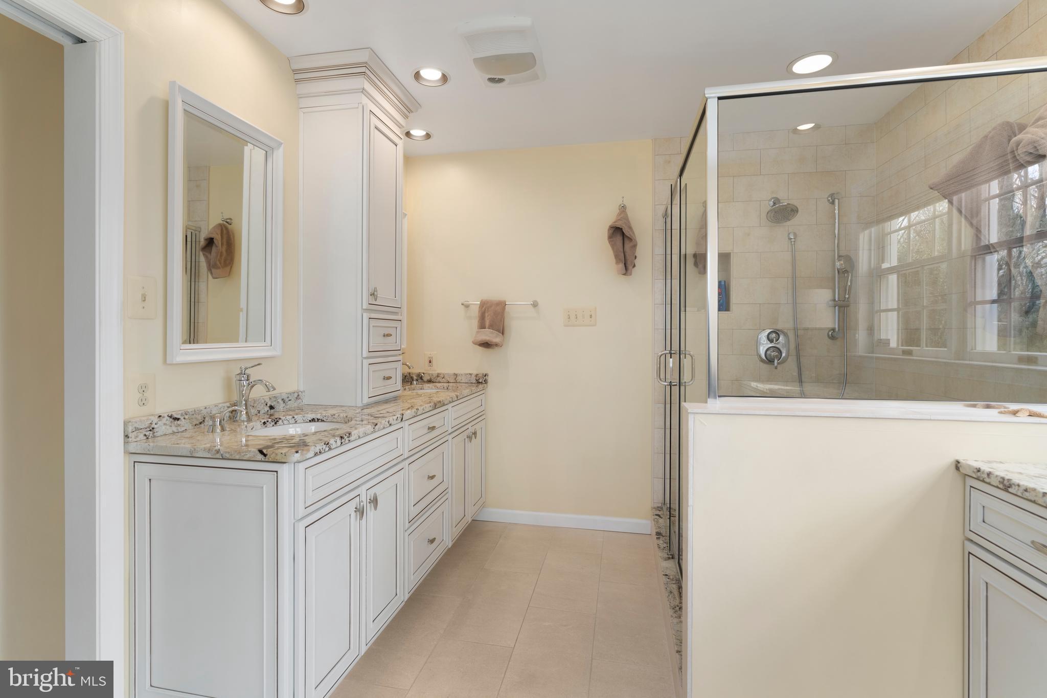 1116 Wiseburg Road Parkton, MD 21120 - Photo 29 of 54 a bathroom with a double vanity sink mirror and shower