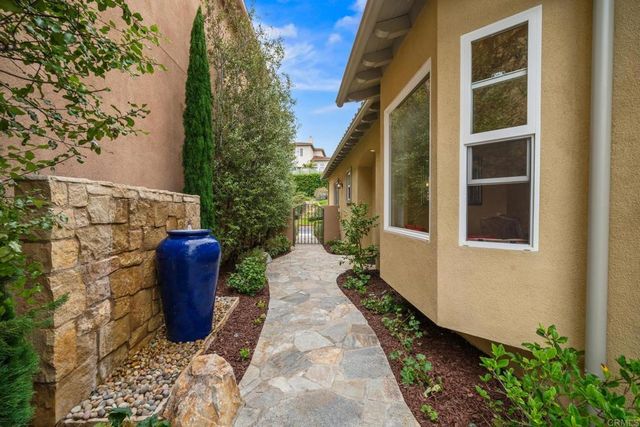 a view of a dining room with furniture wooden floor and chandelier