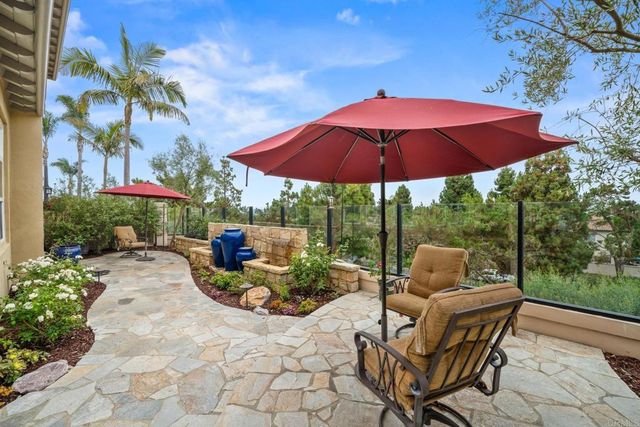 an aerial view of residential houses with outdoor space and city view