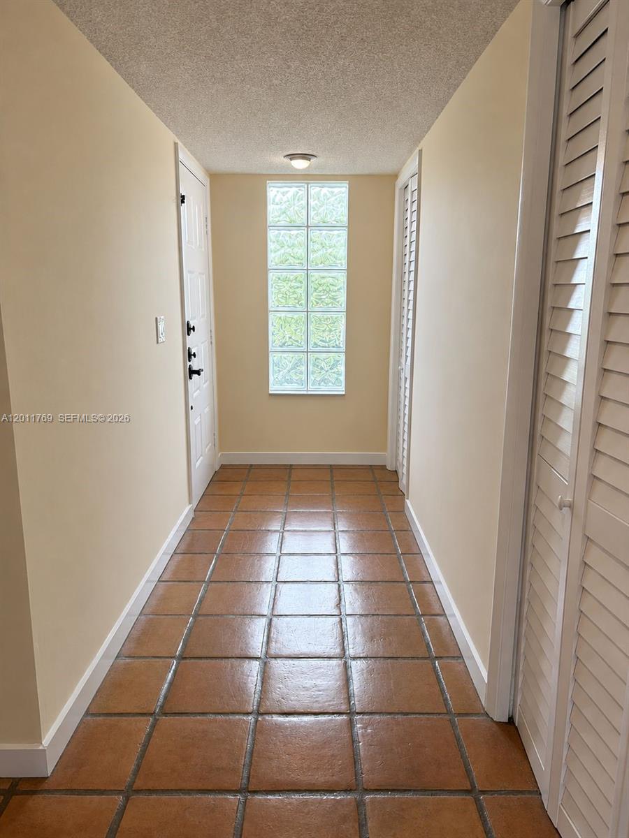 286 Racquet Club Road, Unit 204 Weston, FL 33326 - Photo 4 of 11 a view of empty room with window