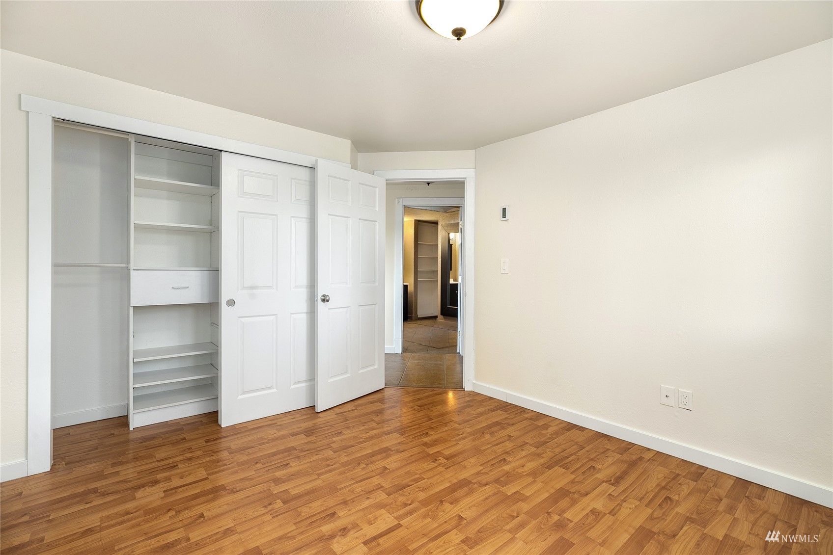 19027 Nutmeg Street Southwest Rochester, WA 98579 - Photo 11 of 22 a view of an empty room with closet and wooden floor