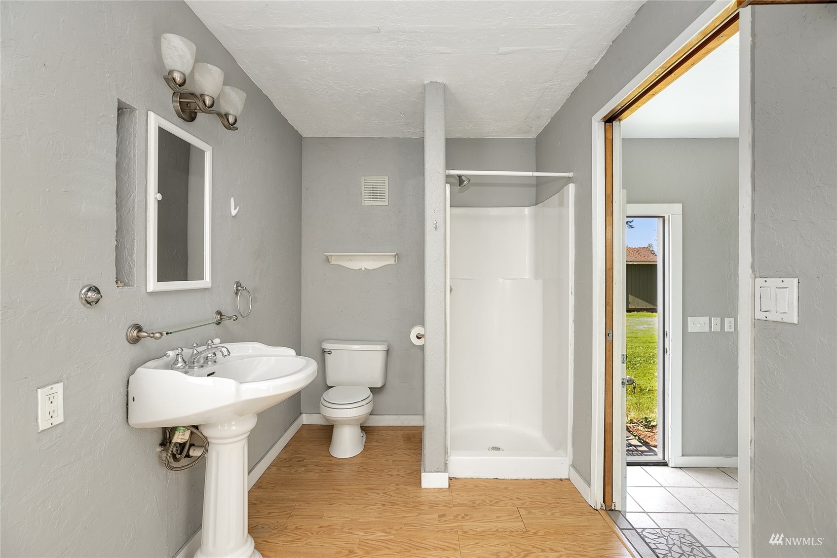 19027 Nutmeg Street Southwest Rochester, WA 98579 - Photo 16 of 22 a bathroom with a sink a toilet and shower