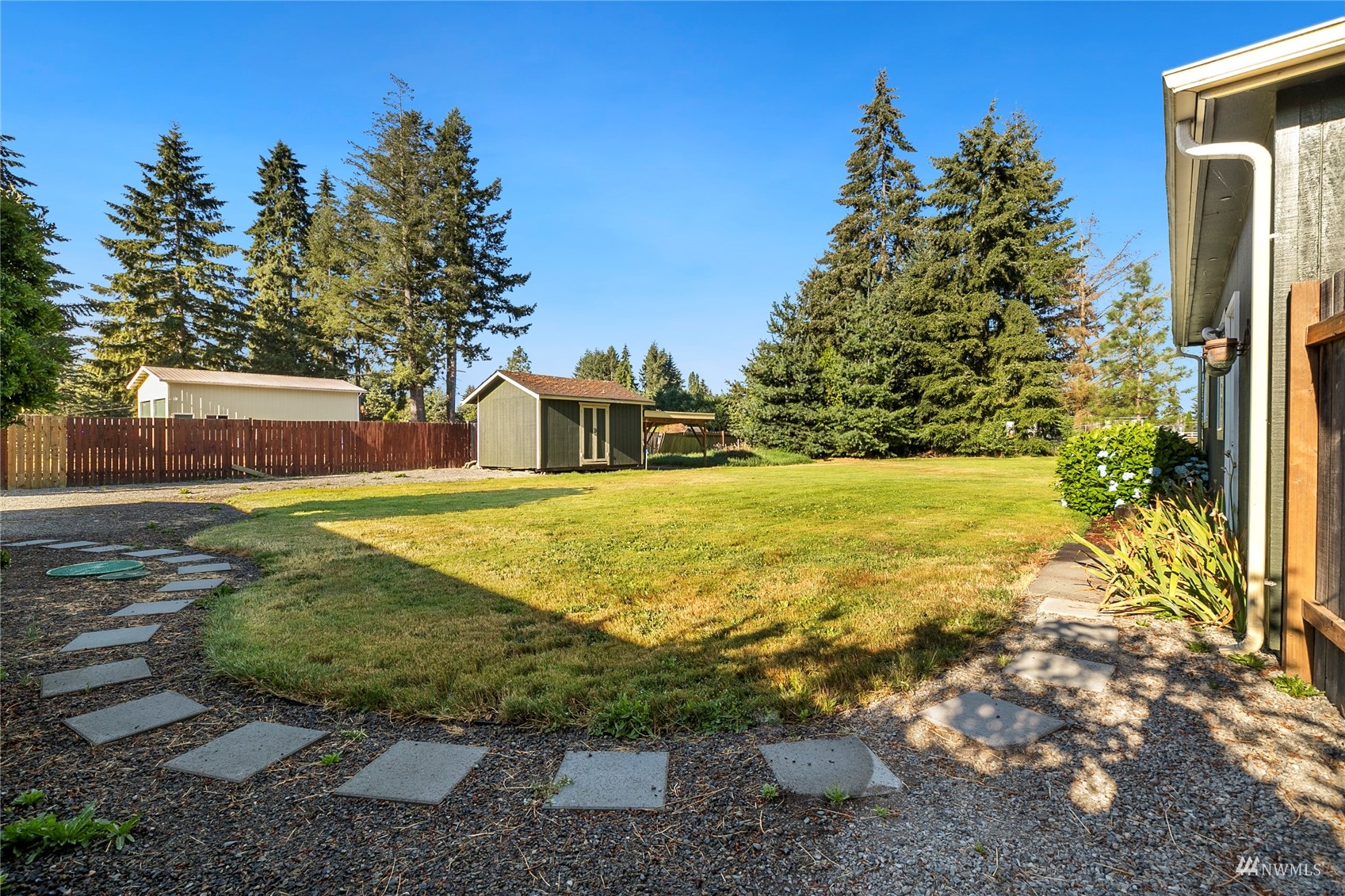19027 Nutmeg Street Southwest Rochester, WA 98579 - Photo 19 of 22 a view of a swimming pool with an outdoor space and seating area