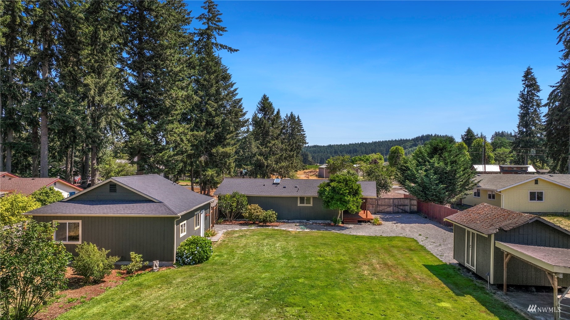 19027 Nutmeg Street Southwest Rochester, WA 98579 - Photo 3 of 22 a front view of a house with a garden