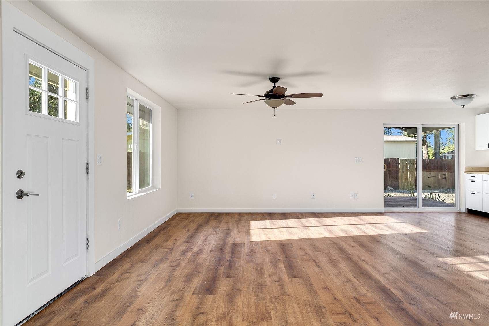 19027 Nutmeg Street Southwest Rochester, WA 98579 - Photo 5 of 22 a view of empty room with wooden floor and fan