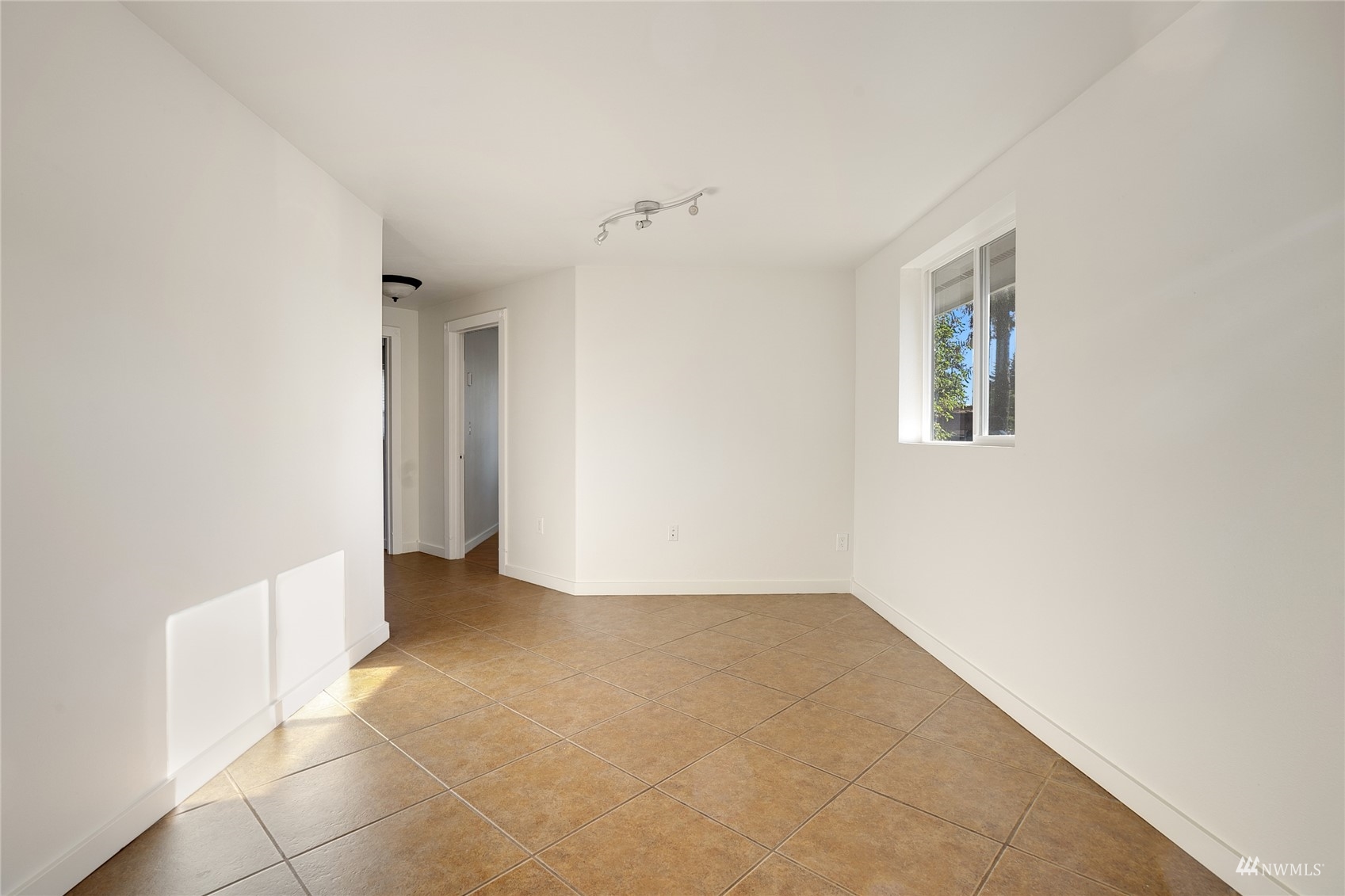19027 Nutmeg Street Southwest Rochester, WA 98579 - Photo 10 of 22 an empty room with a natural light