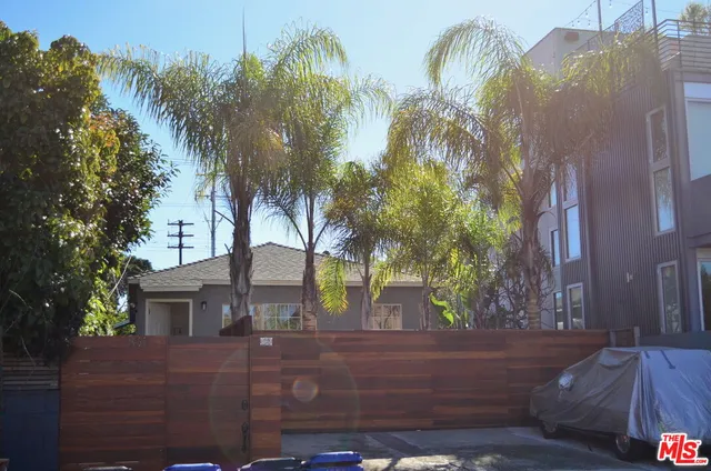 a view of a house with a yard and plant