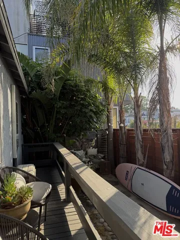 a view of balcony with furniture