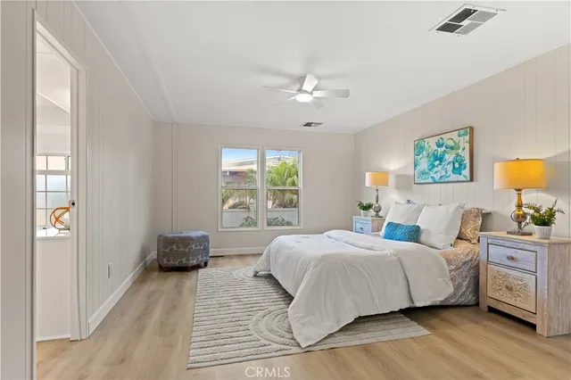 a bedroom with a large bed and a window