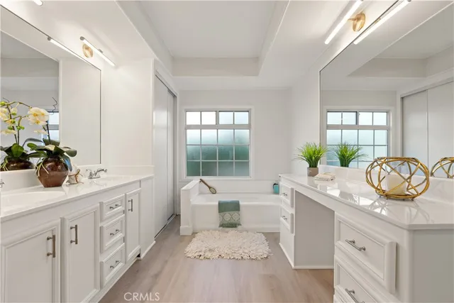 a bathroom with a double vanity sink and mirror