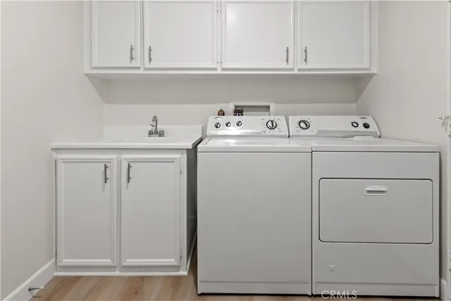a kitchen with white cabinets and a stove