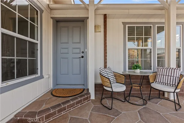 a kitchen with white cabinets stainless steel appliances and sink