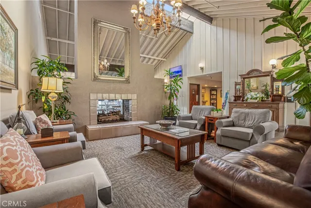 a living room with furniture a dining table and wooden floor