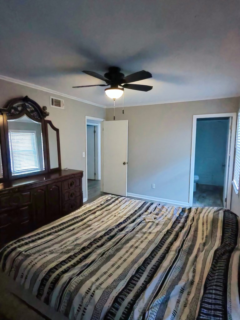 4715 Teak Drive Columbus, GA 31909 - Photo 12 of 19 a bedroom with a bed and a walk in closet