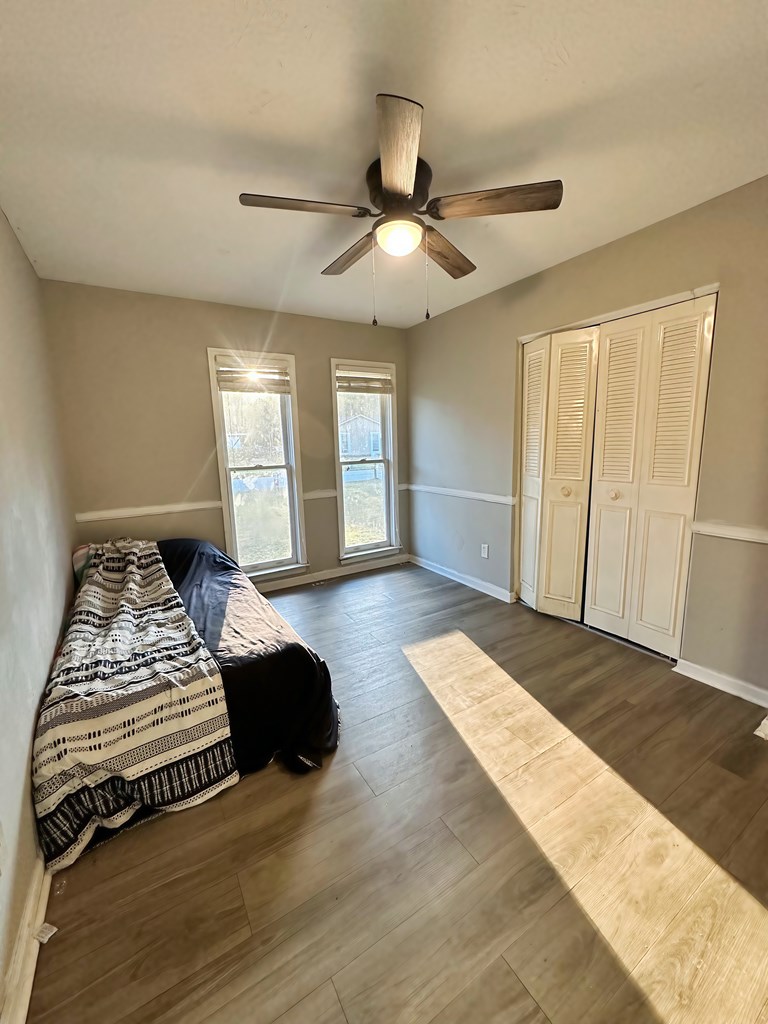 4715 Teak Drive Columbus, GA 31909 - Photo 14 of 19 a bedroom with a bed and a chandelier