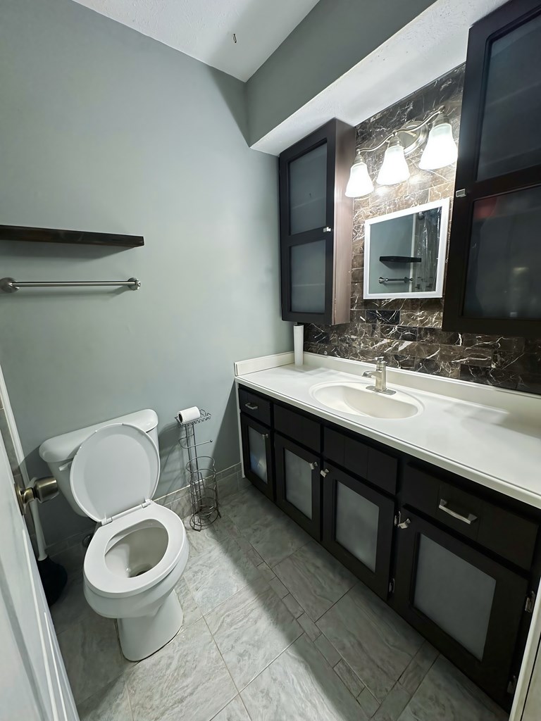 4715 Teak Drive Columbus, GA 31909 - Photo 15 of 19 a bathroom with a toilet a sink and a mirror