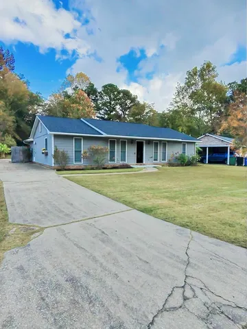 front view of a house with a yard