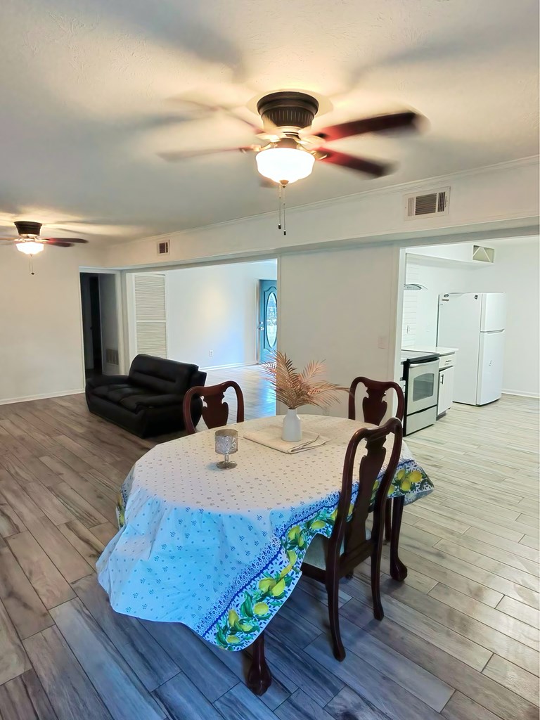 4715 Teak Drive Columbus, GA 31909 - Photo 6 of 19 a view of a dining room with furniture and wooden floor