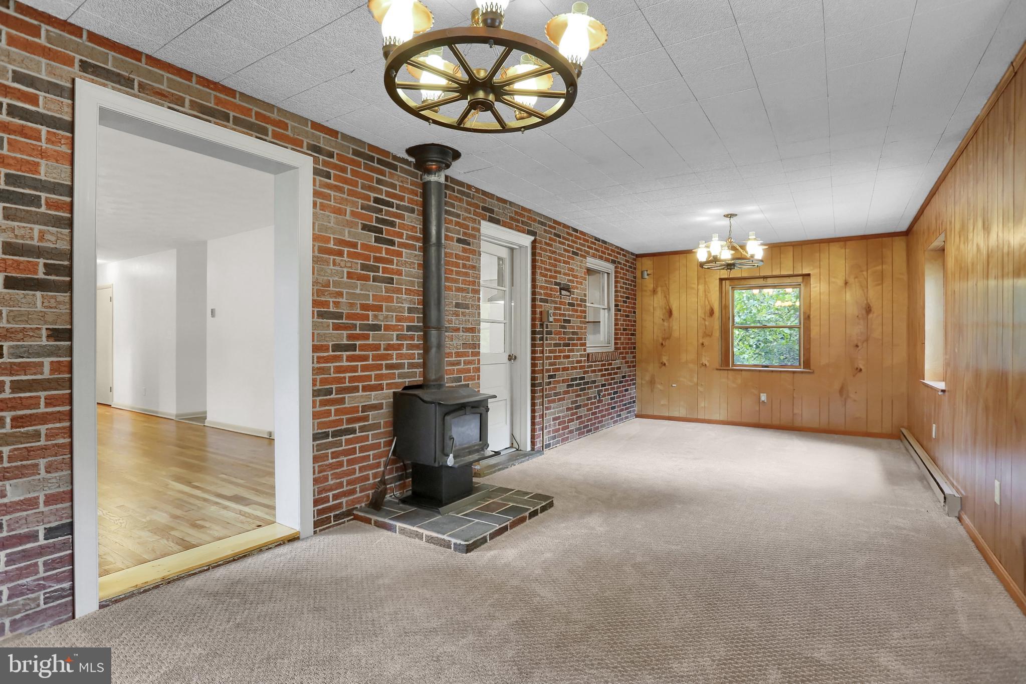 851 Lewisberry Road Lewisberry, PA 17339 - Photo 7 of 41 Family Room with brick wall and real wood paneling