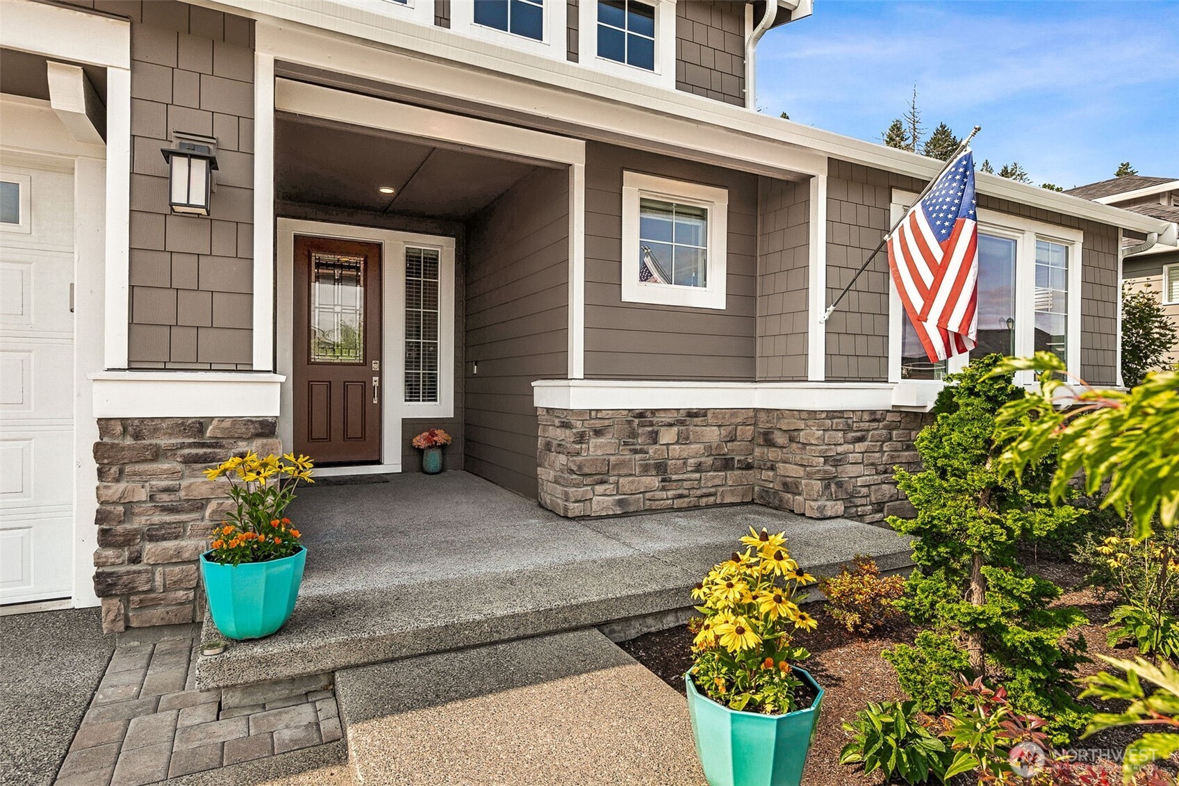 3111 Arrowroot Loop Southeast Olympia, WA 98513 - Photo 2 of 34 a front view of a house with outdoor seating