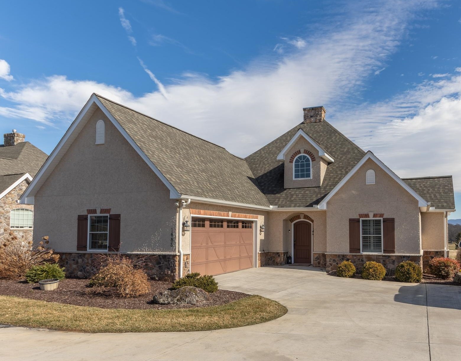 a front view of a house with a yard