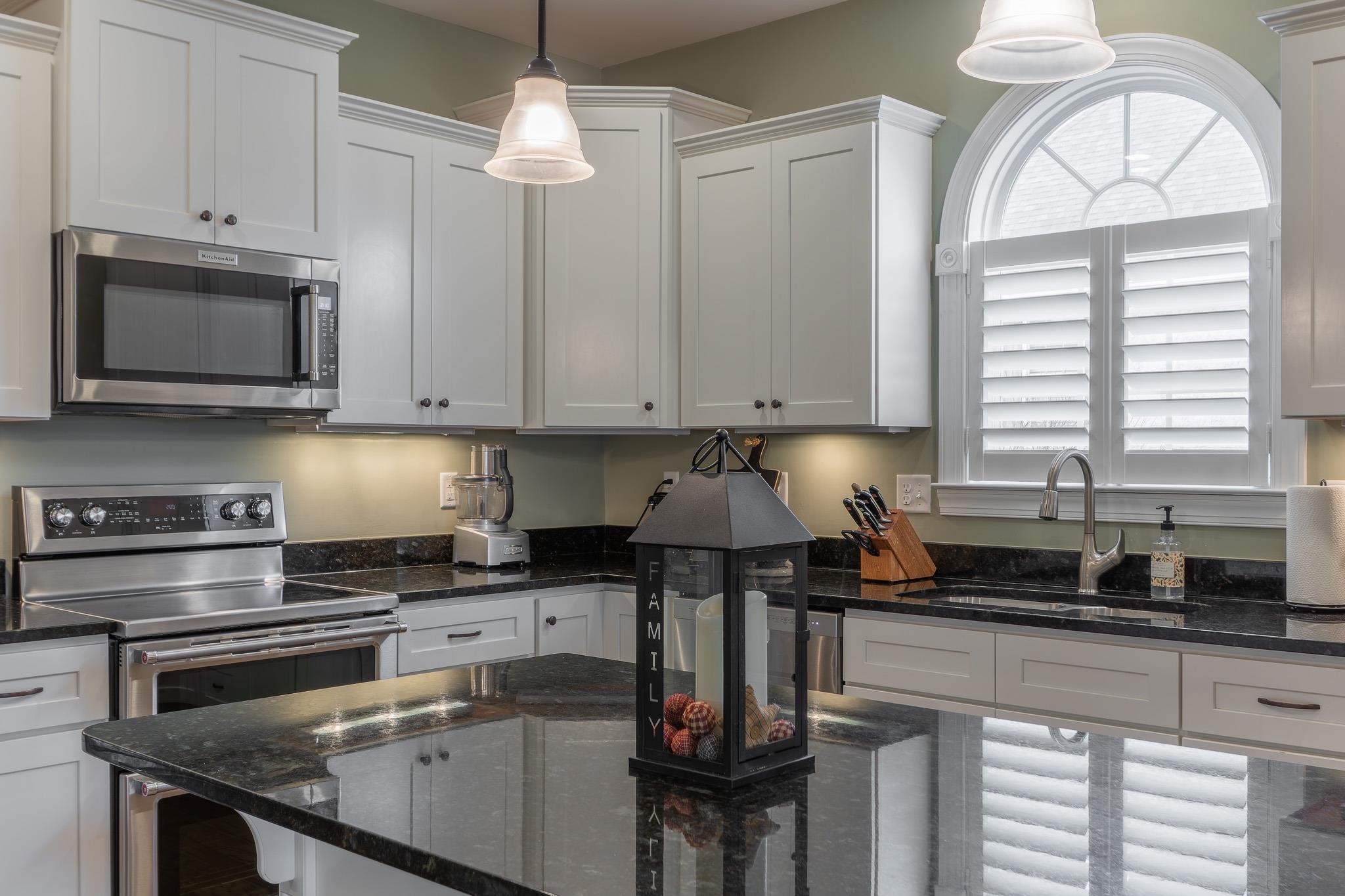 1685 Bald Eagle Circle Harrisonburg, VA 22801 - Photo 20 of 53 a kitchen with stainless steel appliances granite countertop a stove a sink and a microwave