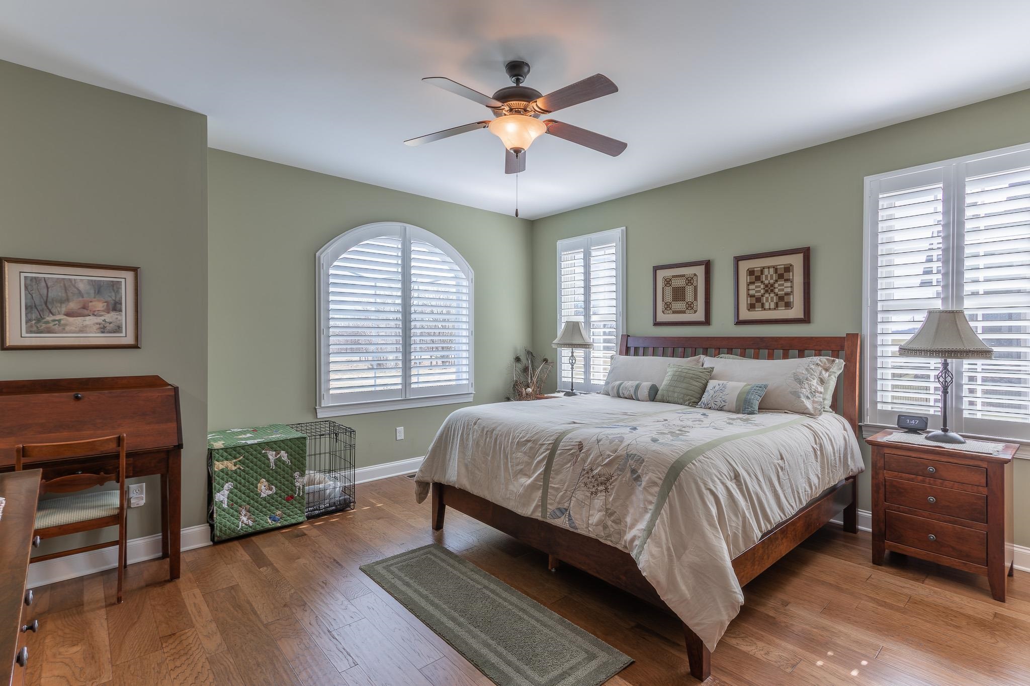 1685 Bald Eagle Circle Harrisonburg, VA 22801 - Photo 31 of 53 a bedroom with a large bed and a chandelier