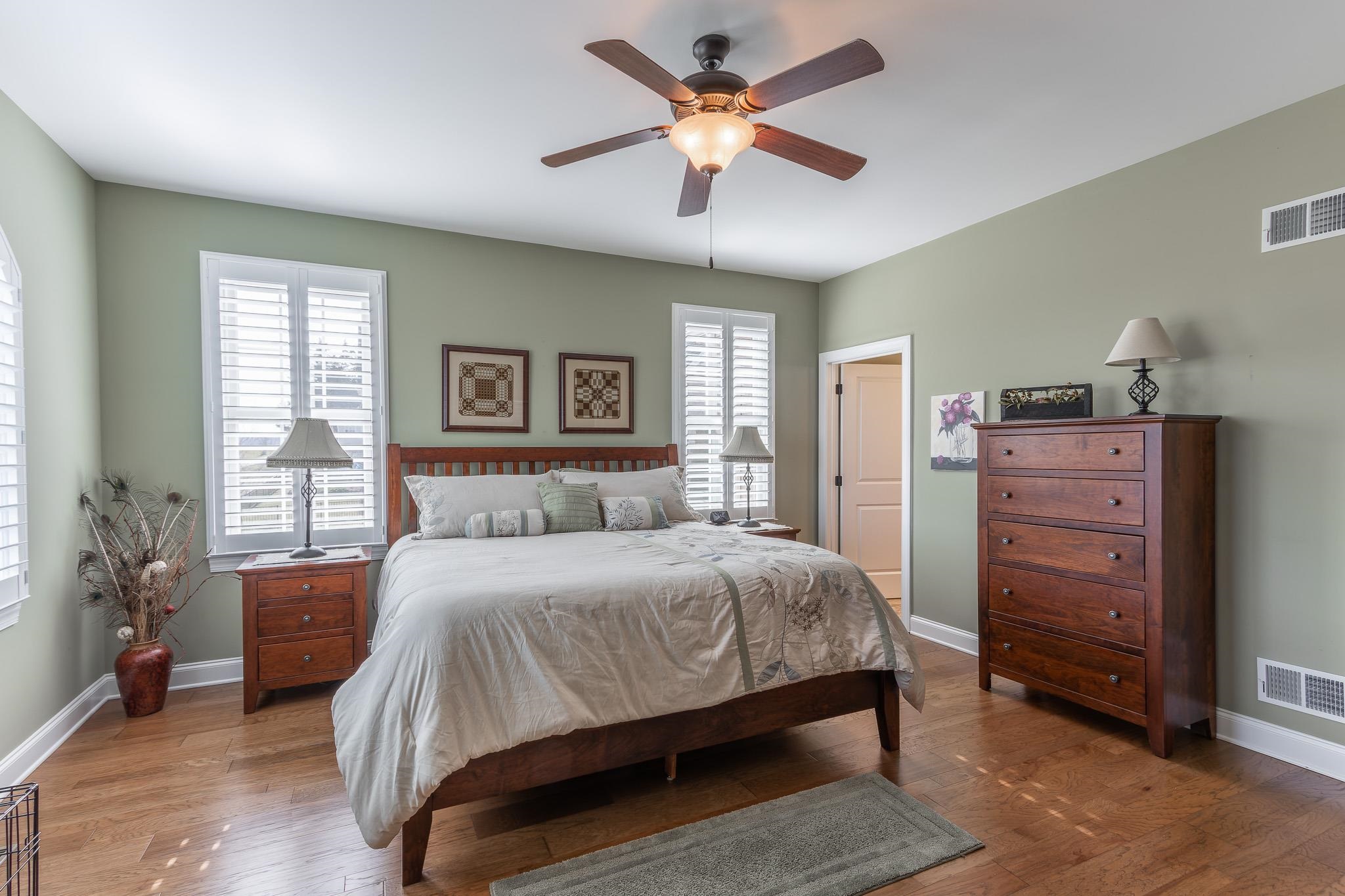 1685 Bald Eagle Circle Harrisonburg, VA 22801 - Photo 32 of 53 a bedroom with a bed and a chandelier