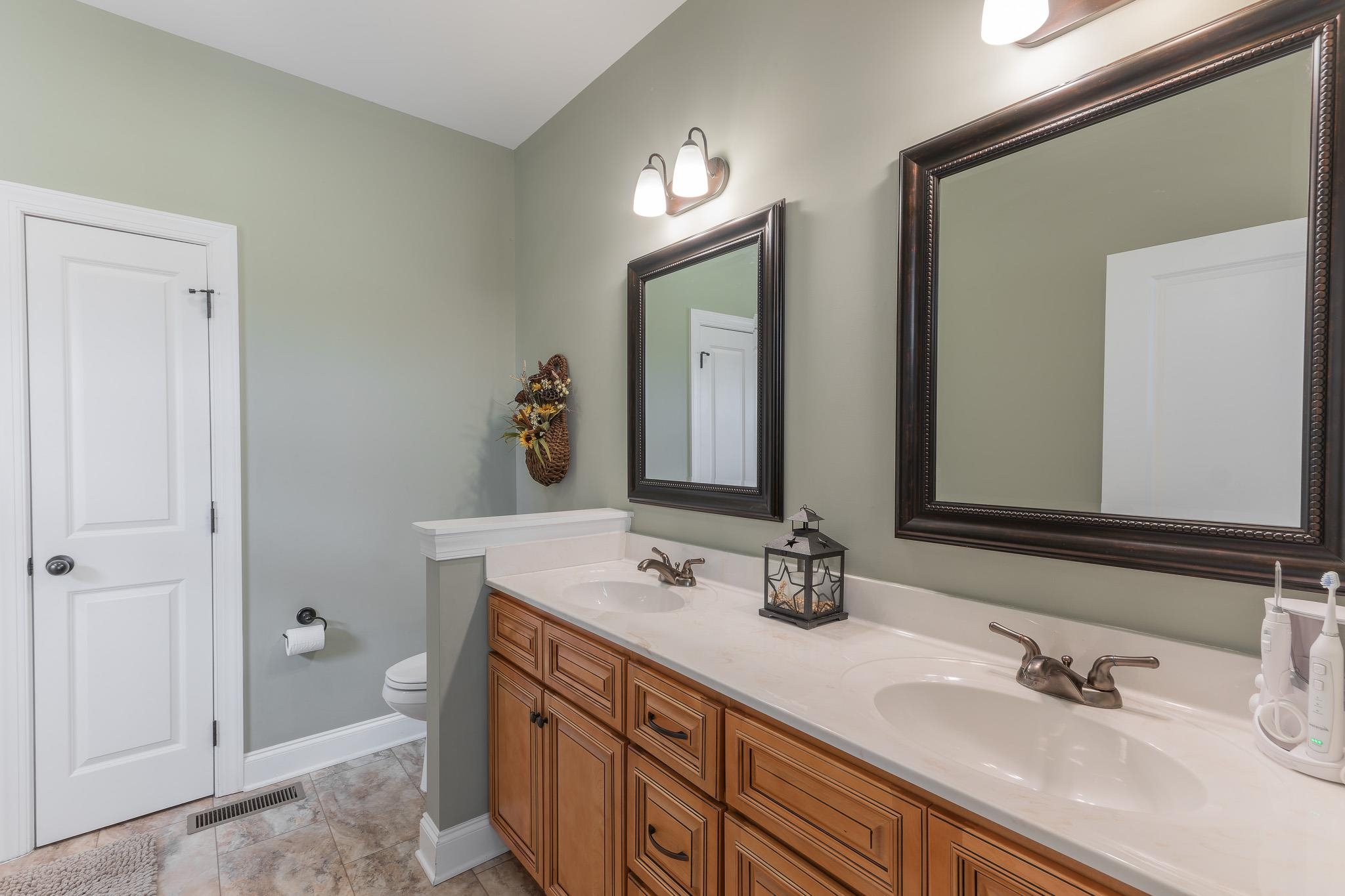 1685 Bald Eagle Circle Harrisonburg, VA 22801 - Photo 35 of 53 a bathroom with double vanity sinks and a mirror