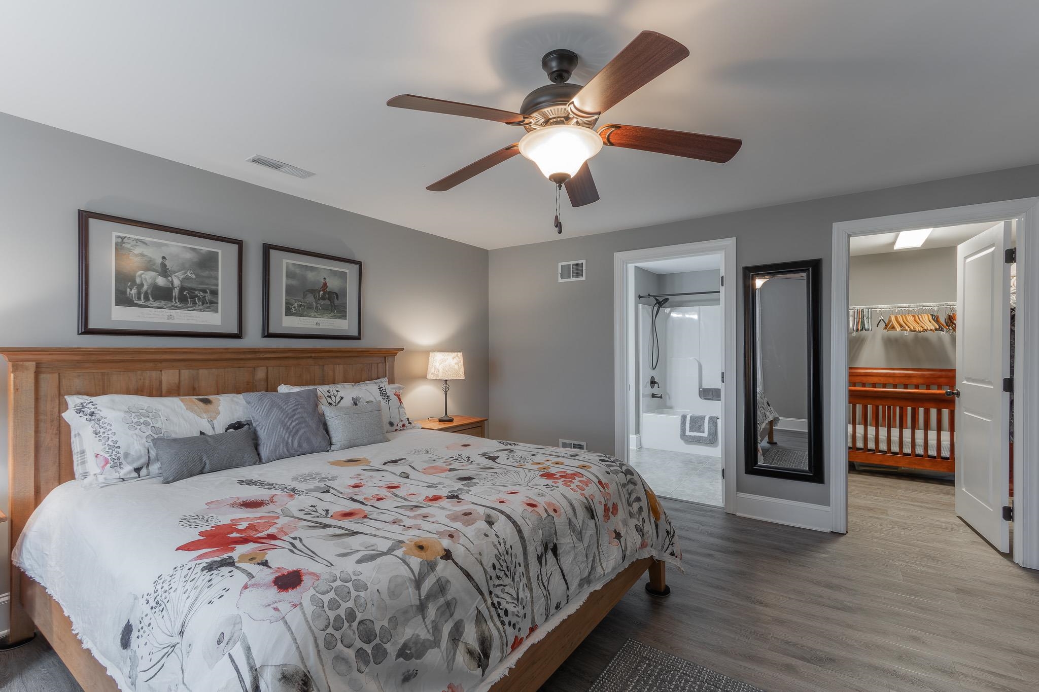 1685 Bald Eagle Circle Harrisonburg, VA 22801 - Photo 45 of 53 a bedroom with a large bed and a chandelier