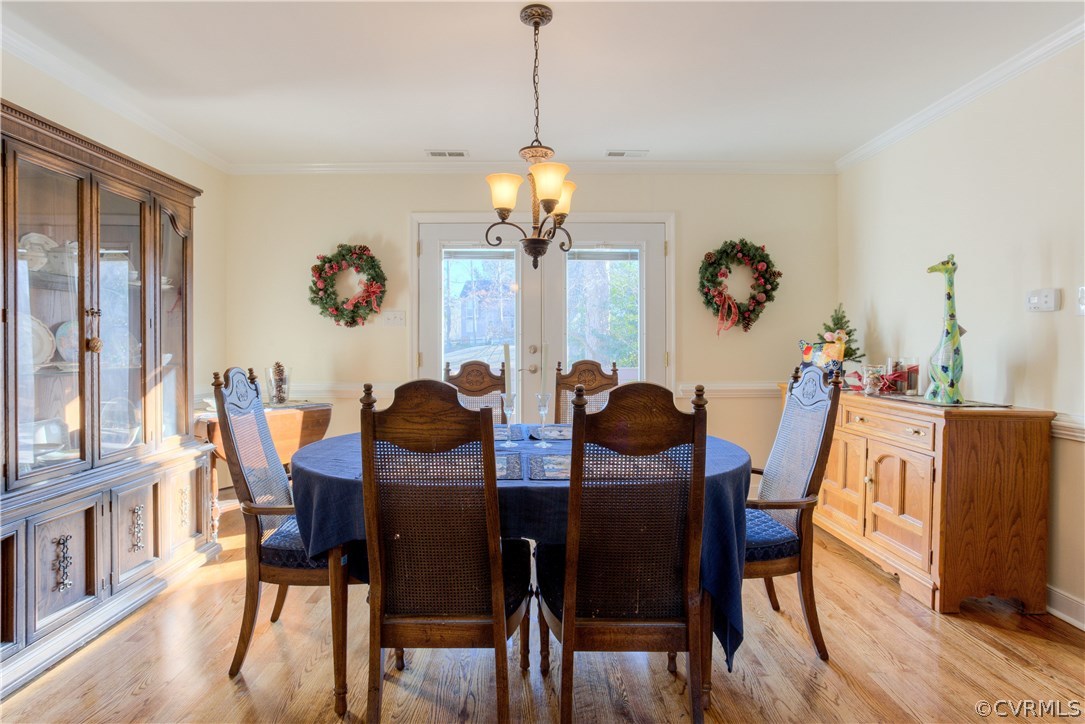 14018 Sagebrook Road Midlothian, VA 23112 - Photo 15 of 28 a view of a dining room with furniture window and wooden floor