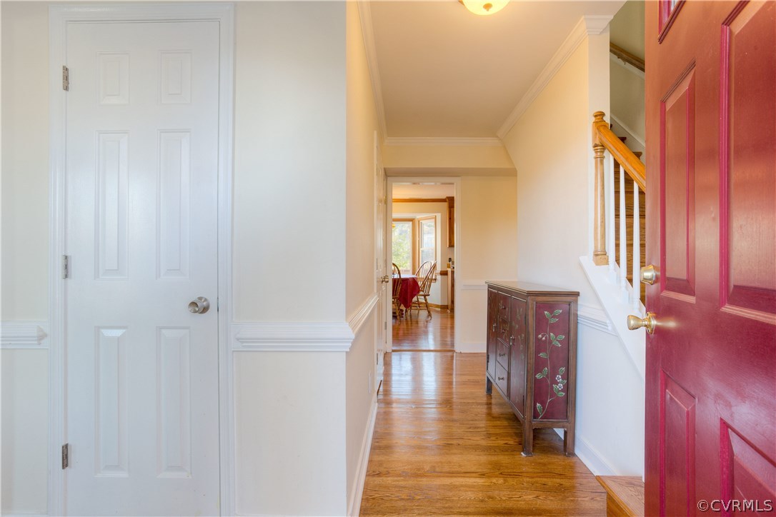 14018 Sagebrook Road Midlothian, VA 23112 - Photo 5 of 28 a hallway with a dining table and chairs