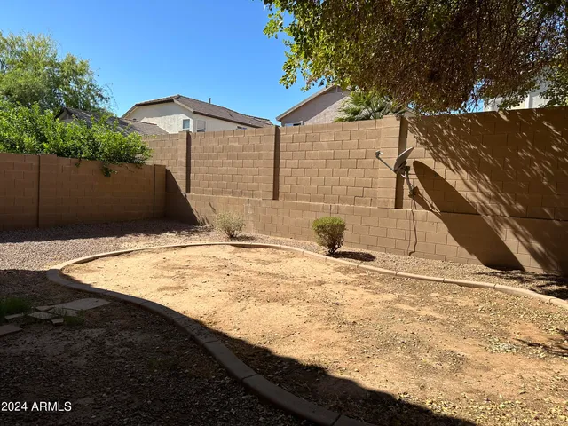 a room with wooden floor and window