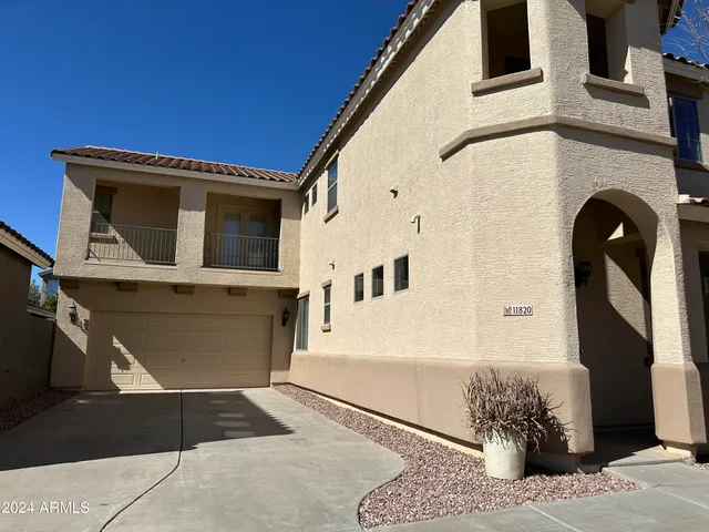 a front view of a house with a garage