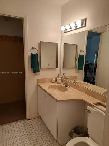 a bathroom with a toilet and bathtub