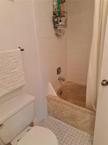 a bathroom with a toilet and a sink