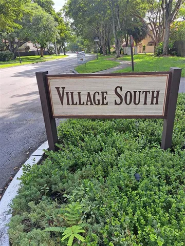 a view of outdoor space with signage and flags