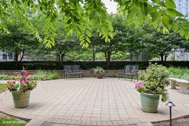 a view of a backyard with sitting area