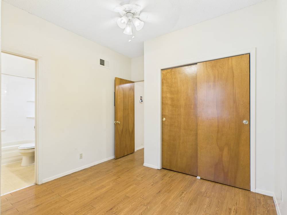 3316 Guadalupe Street, Unit 210 Austin, TX 78705 - Photo 7 of 15 a view of an empty room with chandelier fan