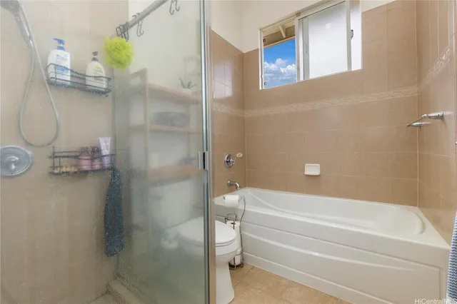 a bathroom with a shower and a toilet