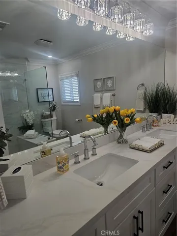 a kitchen with a sink and a stove top oven
