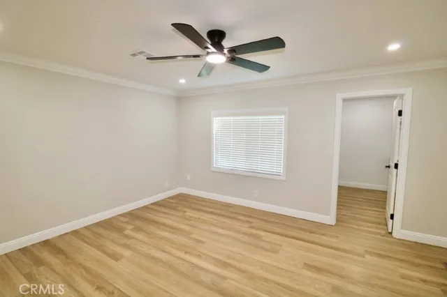 a bathroom with a double vanity sink and toilet