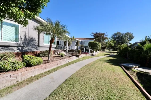 a view of a house with couches chair and table