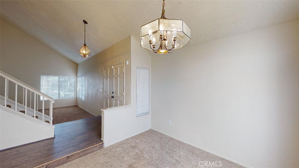 12246 Pluto Drive Victorville, CA 92392 - Photo 11 of 64 a view of an entryway with wooden floor